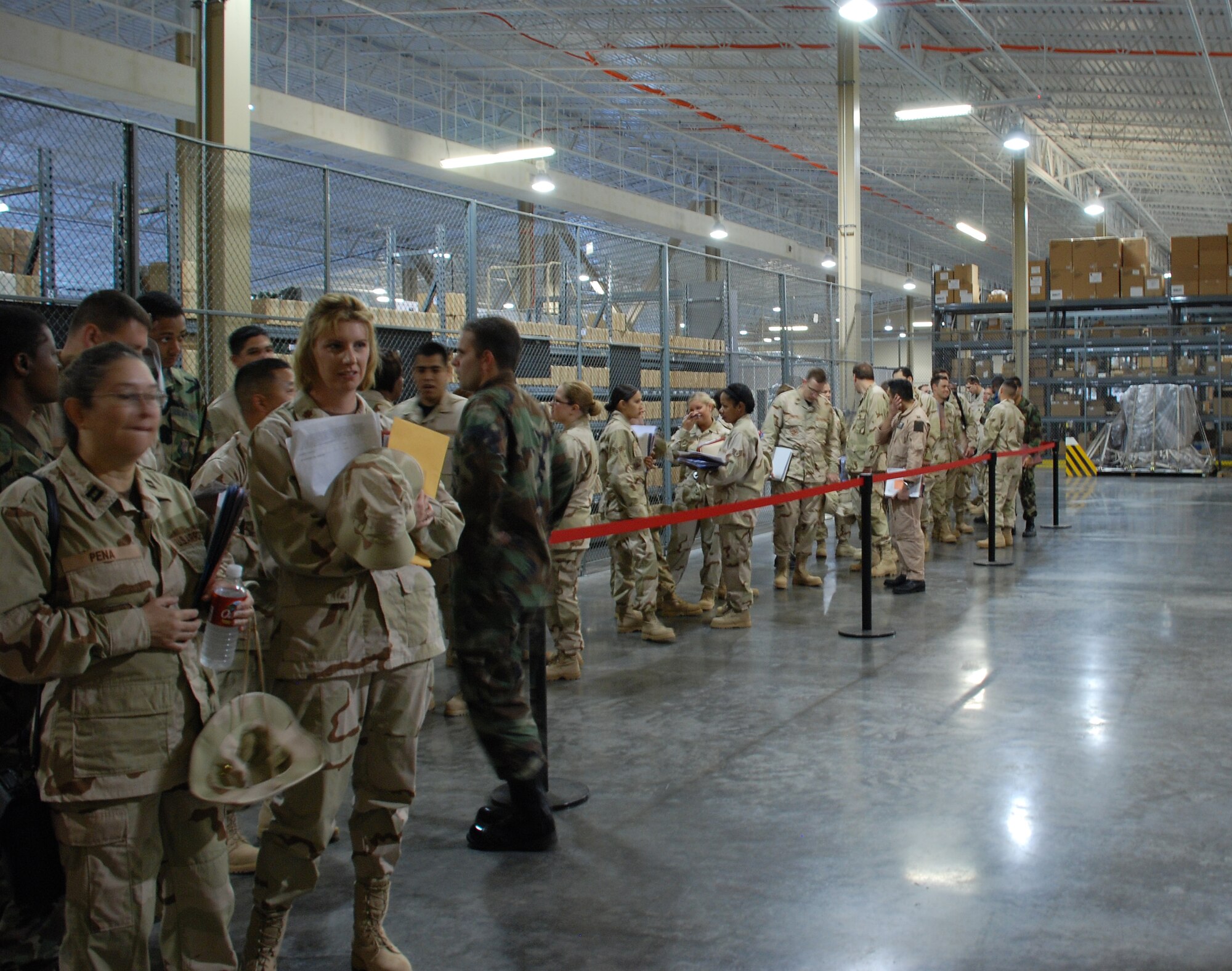 Team Sheppard members wait to go through the mobility line May 2. Team Sheppard is preparing to deploy over 100 Airmen to locations around the globe in support of the global war on terrorism. (U.S. Air Force photo/Airman 1st Class Jacob Corbin)