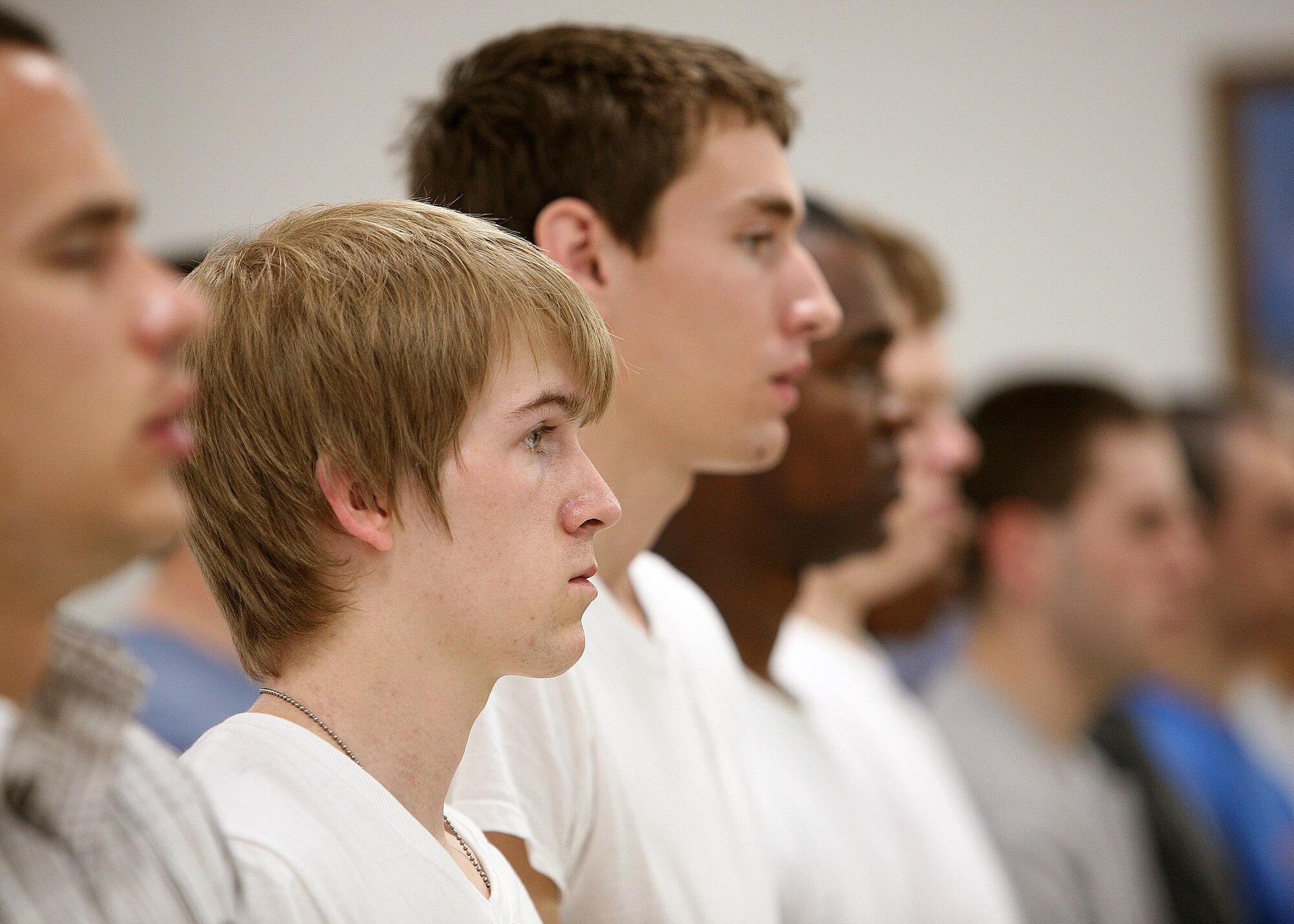 Air Force basic trainees wait their turn for a haircut May 2 at the clipper cuts at Lackland Air Force Base, Texas. These trainees are assigned to the 323rd Training Squadron's Flight 393. They are scheduled to graduate June 15. (U. S. Air Force photo/Robbin Cresswell)