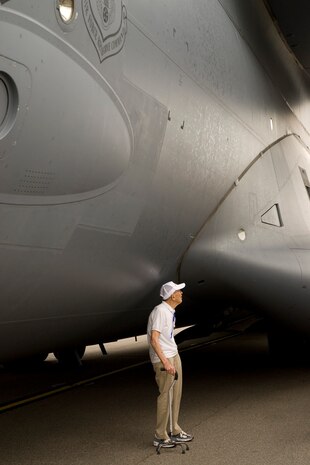 Fletcher Hanks, husband of Red Hanks, a nurse who served with the Flying Tigers, checks out a C-17 during the Flying Tigers reunion April 27. (U.S. Air Force photo/Senior Airman Sam Hymas)