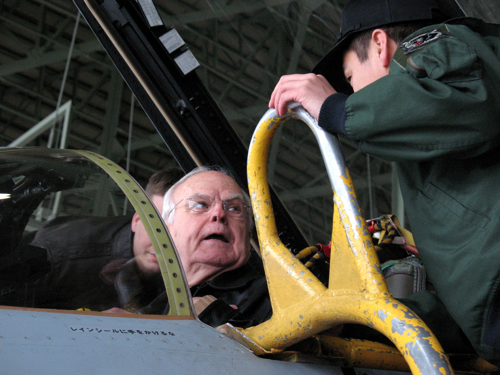 Retired Col. James Gilliland shares war stories with an RF-4C pilot from the Japanese Air Self Defense Squadron at Misawa Air Base, Japan. Colonel Gilliland flew 100 reconnaissance missions in the RF-4C during the Vietnam War. (U.S. Air Force photo/Senior Airman Gena Armstrong)

 
