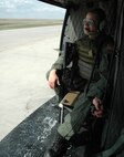 MINOT AIR FORCE BASE, N.D. -- Airman 1st Class Cody Chick, 91st Security Forces Group, sits somber and alert as he prepares for takeoff during a security mission with the 54th Helicopter Squadron here April 26. The mission of the 54th HS is to ensure the integrity of the 91st Space Wing’s nuclear deterrence by providing immediate, flexible and effective combat helicopter support anywhere, anytime. (U.S. Air Force photo by Airman 1st Class Wesley Wright)