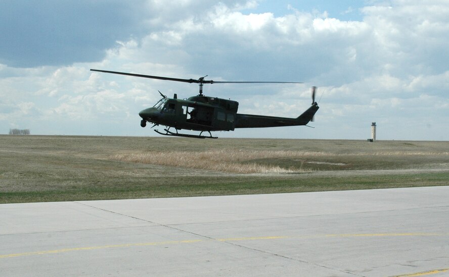 MINOT AIR FORCE BASE, N.D. -- A UH-1N Huey helicopter from the 54th Helicopter Squadron here takes off on a security mission April 26. The mission of the 54th HS is to ensure the integrity of the 91st Space Wing’s nuclear deterrence by providing immediate, flexible and effective combat helicopter support anywhere, anytime. (U.S. Air Force photo by Airman 1st Class Wesley Wright)