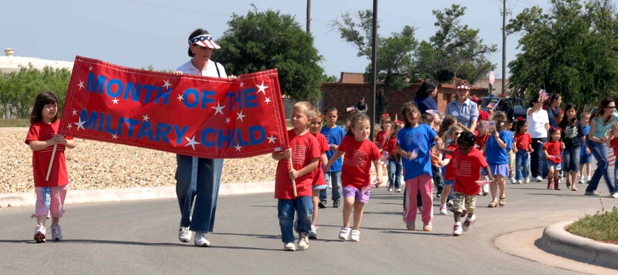 Dyess' Child Development Center sponsored a parade in honor of the Month of the Military Child April 27. The parade, one of many events for the month, is held annually by the CDC and included 200 children and their parents from the CDC, a fire truck, Sparky the Fire Dog, and other interesting characters. (U.S. Air Force photo by Airman 1st Class Domonique Simmons)