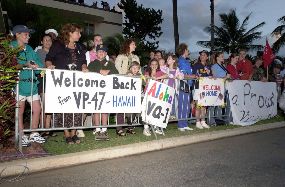 A crowd gathers at Hickam Air Force Base, Hawaii to welcome home the crew of the EP-3 reconnaissance plane that collided with a Chinese fighter over the South China Sea. (TSgt. Paul Holcomb, USAF) 