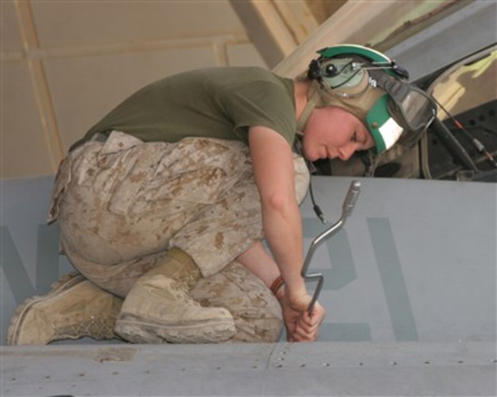 U.S. Marine Corps Lance Cpl. Blythe Jones prepares to install a global positioning system in an F/A-18D Hornet aircraft at Al Asad Air Base, Iraq, on April 25, 2007.  Jones is assigned as an aviation electrician with Marine All Weather Fighter Attack Squadron 121.  