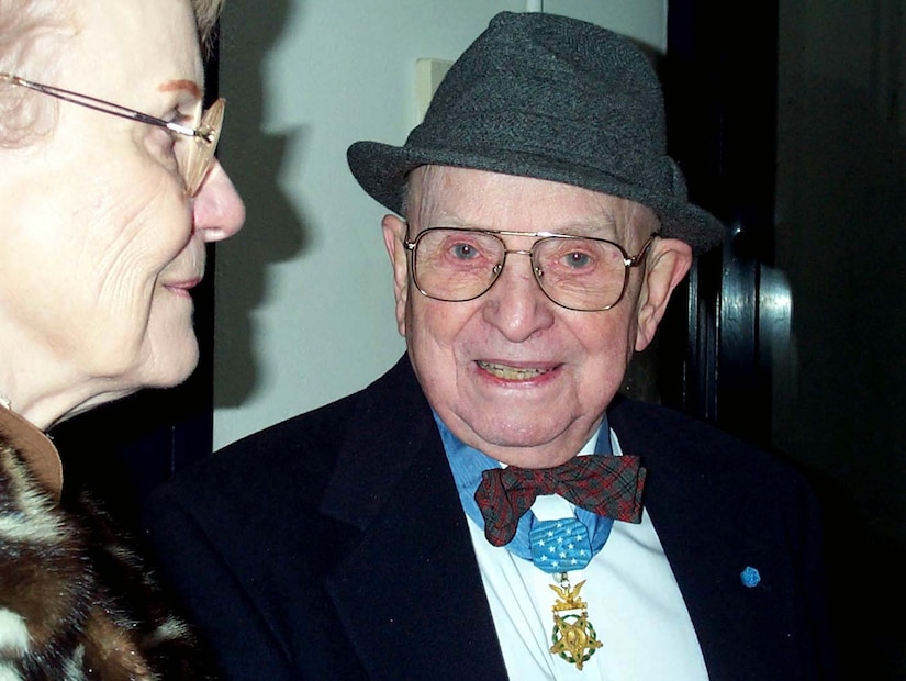 Medal of Honor recipient Nicholas Oresko of Tenafly, N.J., and his friend Genevieve Doocey attend a Salute to Veterans hosted by then Vice President-elect Dick Cheney at the George Washington University Smith Center in Washington D.C. The pre-inaugural event Jan. 19, 2001, was just one honoring 100 living Medal of Honor heroes. Oresko, a World War II veteran, has attended all the nation's presidential inaugurations since Dwight D. Eisenhower became president. Photo by Linda D. Kozaryn.