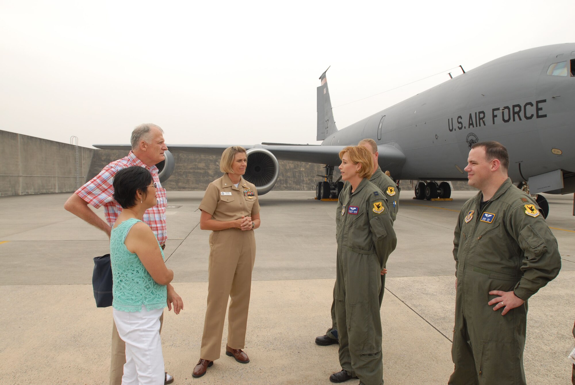 Capt. Jeannette Ward (second from right) talks with Jim and Marite Brierly while Cmdr. (Dr.) Sharon Troxel and Maj. (Dr.) Dan Cole look on at Kadena Air Base, Japan, on May 2, 2007.  Doctors Troxel and Cole and Captain Ward were part of the team that treated and medically evacuated Mr. Brierly to Hawaii after he suffered a major heart attack.  Mr. and Mrs. Brierly visited the units to thank them for their efforts.  Mr. Brierly teaches English as a second language at Kadena Elementary School.  Doctor Troxel is the head of the emergency department at U.S. Navy Hospital-Okinawa.  Doctor Cole is the 18th Medical Operations Squadron medical services flight commander and a critical care medical attendant team staff physician for pulmonary and critical care.  Captain Ward is a flight nurse with the 18th Aeromedical Evacuation Squadron. (U.S. Air Force photo by Airman 1st Class Kasey Zickmund)