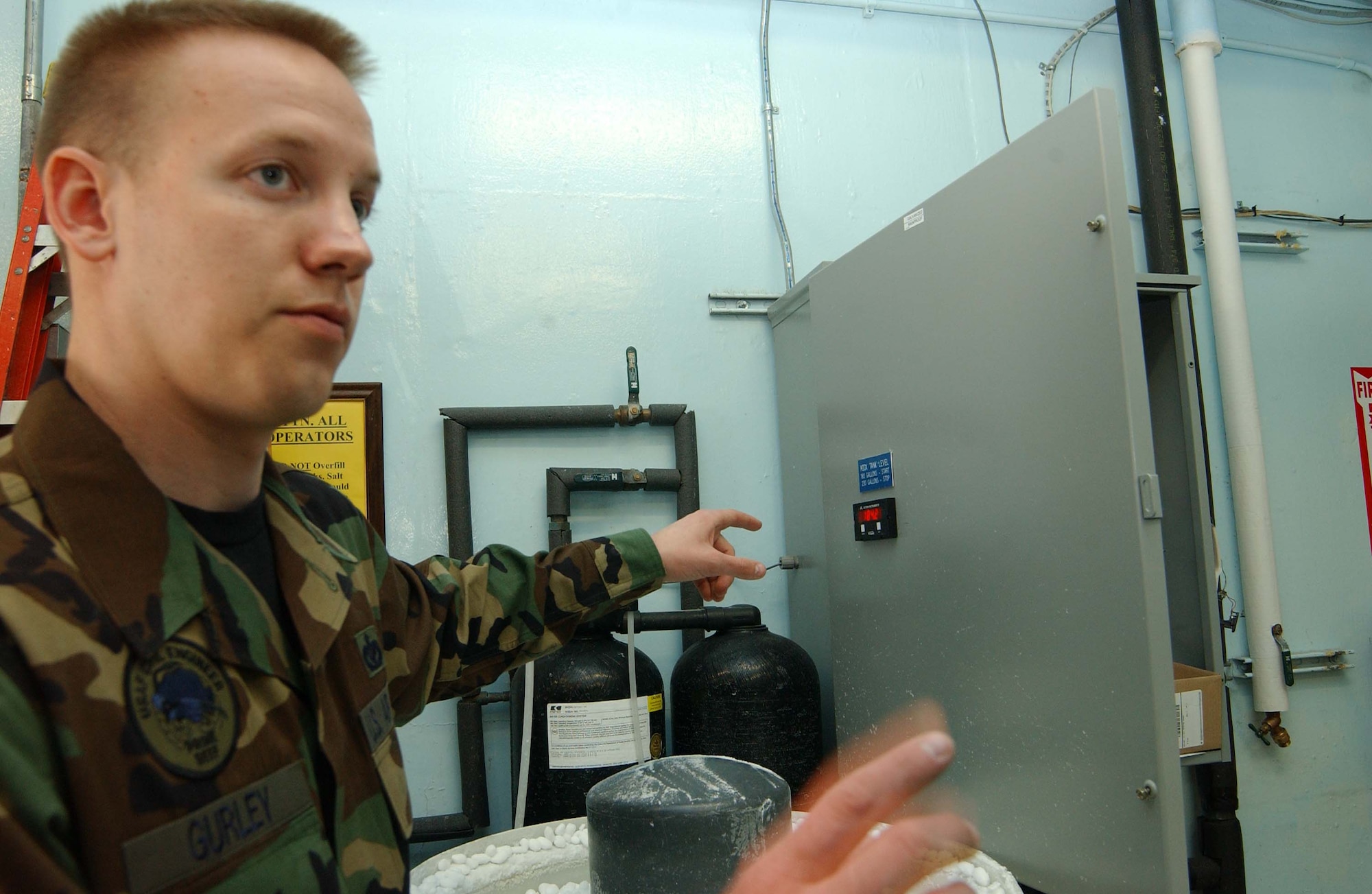 EIELSON AIR FORCE BASE, Alaska -- SSgt Brad Gurley from the Base Water Treatment Plant explains that these numbers indicate the MIOX (mixed oxinate) machine's tank level of disinfectant for the base's water.  If the tank level is below 180 then, the MOX must be turned on, which is all automated.  This is part of a Water Analysis process.  Water Analyis tests for the major elements, Chlorine, Floride, Phosphate, Maganese, Iron, and Ph levels, among many others.  (U.S. Air Force photo by SrA Rachel Walters) 