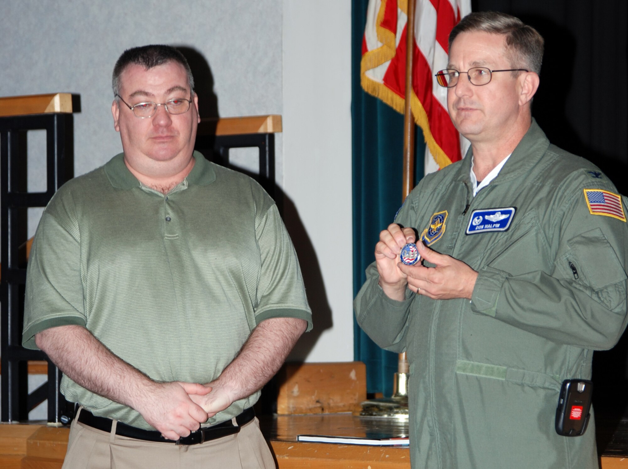 Col. Donald J. Halpin, right, 22nd Air Refueling Wing commander, presents a coin to retired Lt. Col. Steve Dorfman, from Embry-Riddle Aeronautical University, April 27, to show Team McConnell’s appreciation for his participation in the 22nd ARW’s guest speaker series. 

Mr. Dorfman spoke earlier that day at the Dole Center to Team McConnell members about the history of the Air Force and Air Mobility Command. Like Mr. Dorfman, future speakers who plan to participate in the guest speaker series are from universities and learning institutions around Wichita. 

The series is open to all McConnell personnel and will feature several speakers over the next five months. The goal of the speaker series is to provide Airmen an opportunity to gain insight into Air Force history and the impact it has in its servicemembers and to teach them what to expect for the future of the Air Force. Some speakers will also cover topics geared toward familiarizing Airmen with non-western ways of life. 

The next presenter in the series is Dr. Don Conway Long, from Webster University, who will present ‘Islam 101’ and discuss major topics in non-western religion and culture. The presentation is scheduled for May 18 from 3-4 p.m. in the Dole Center ballroom. (Photo by Airman 1st Class Jessica Lockoski 22nd ARW Public Affairs)