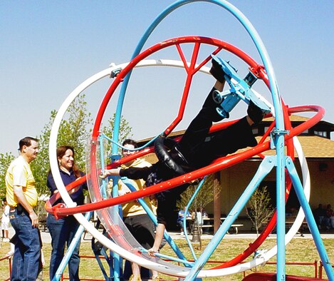 CANNON AIR FORCE BASE, N.M. - A gyro-flip ride spins a Kite Karnival-goer at the 4th annual event April 28 at Doc Stewart Park. An estimated 1,300 children and adultsfrom the base and local communities attended the festivities. (U.S. Air Force photo by Yolanda Romero)                             