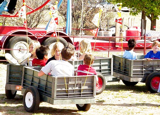CANNON AIR FORCE BASEM N.M. - A train ride takes children on a ride during the 4th Annual Kite Karnival April 28 at Doc Stewart Park. An attempt to break the world's record for most kites flown simultaneously fell short, but an estimated 1,300 children and adults attended the event. (U.S Air Force photo by Yolanda Romero)                                