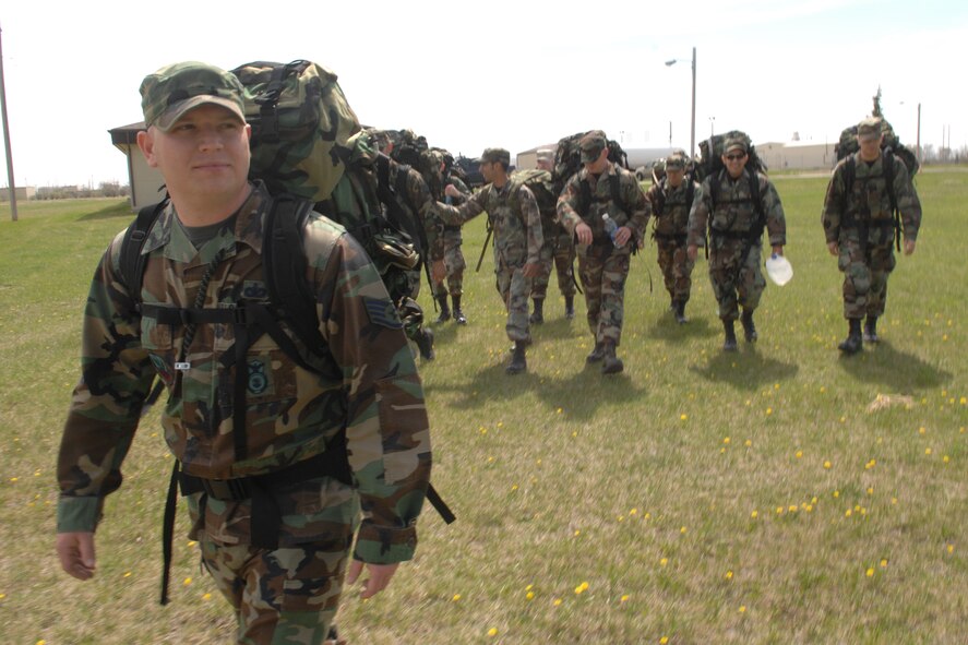 MINOT AIR FORCE BASE, N.D. -- Airmen from the 5th Security Forces Squadron here take part in a "ruck march" May 3 to show support for a fellow squadron member injured in Iraq (U.S. Air Force photo by Senior Airman Stacy Moless).