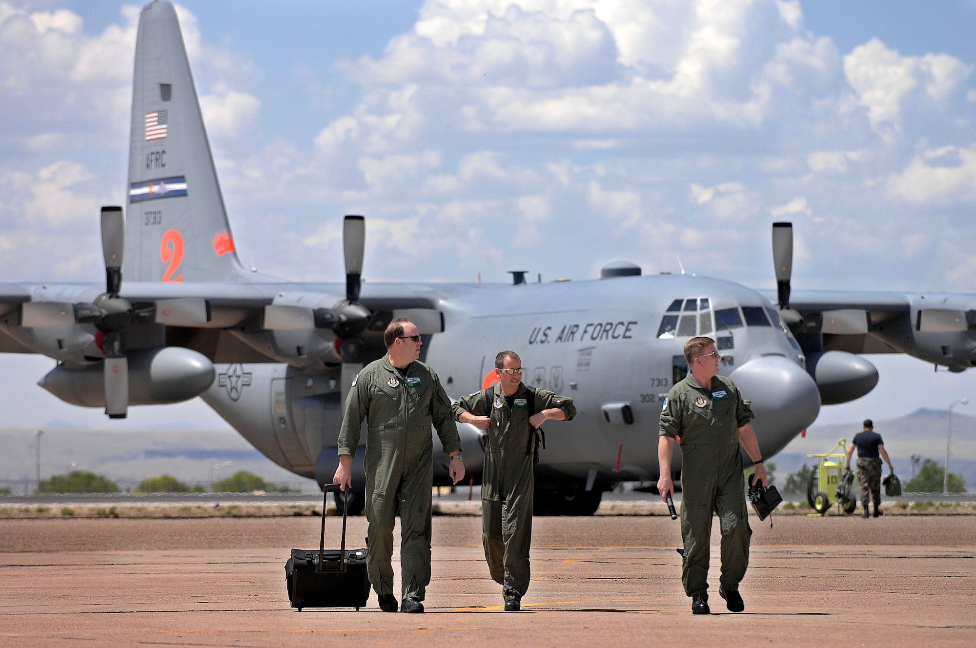 From left, Master Sgt. Tim McWilliams, Senior Master Sgt. Jim Rucker and Senior Master Sgt. Dave Carey finish a day of training April 30 at the Albuquerque Air Tanker Base in New Mexico. C-130 Hercules aircrews from the Air Force Reserve Command and Air National Guard units began arriving April 30 for the first day of Modular Airborne Fire Fighting System training at the U.S. Forest Service's in Albuquerque. The sergeants are flight engineers from the 731st Airlift Squadron at Peterson Air Force Base, Colo. (U.S. Air Force photo/Tech. Sgt. Rick Sforza) 