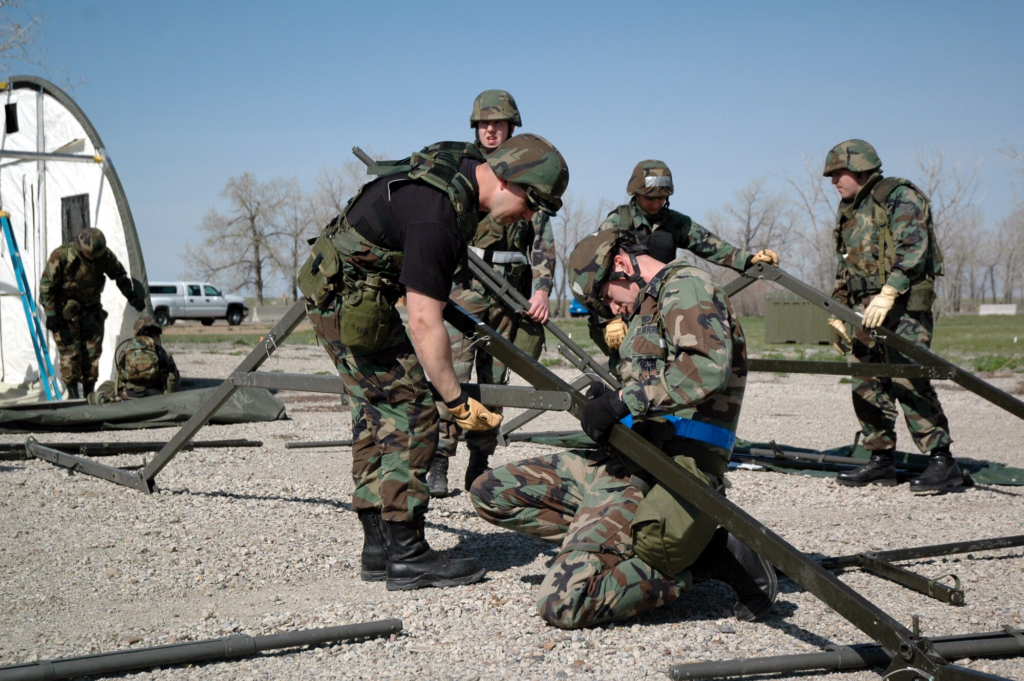 Members of the 341st Civil Engineer Squadron set up tents Monday for their week-long field training exercise at Camp Grizzly, which ended today. (U.S. Air Force photo / Airman 1st Class Emerald Ralston)
