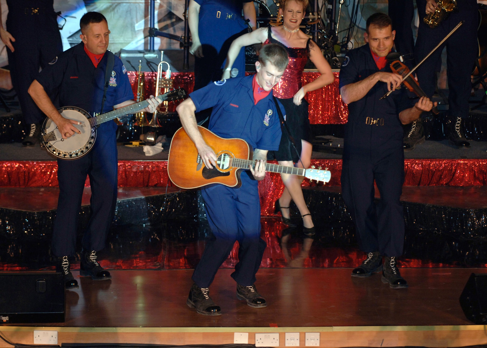 The Tops in Blue crew performs for the members of the 386th Air Expeditionary Wing May 2, at an undisclosed location in Southwest Asia. Known as the Air Forces' Expeditionary Entertainers; the group's main mission is to perform for military personnel and their families throughout the world. (U.S. Air Force photo/Tech Sgt. Edward D. Holzapfel)