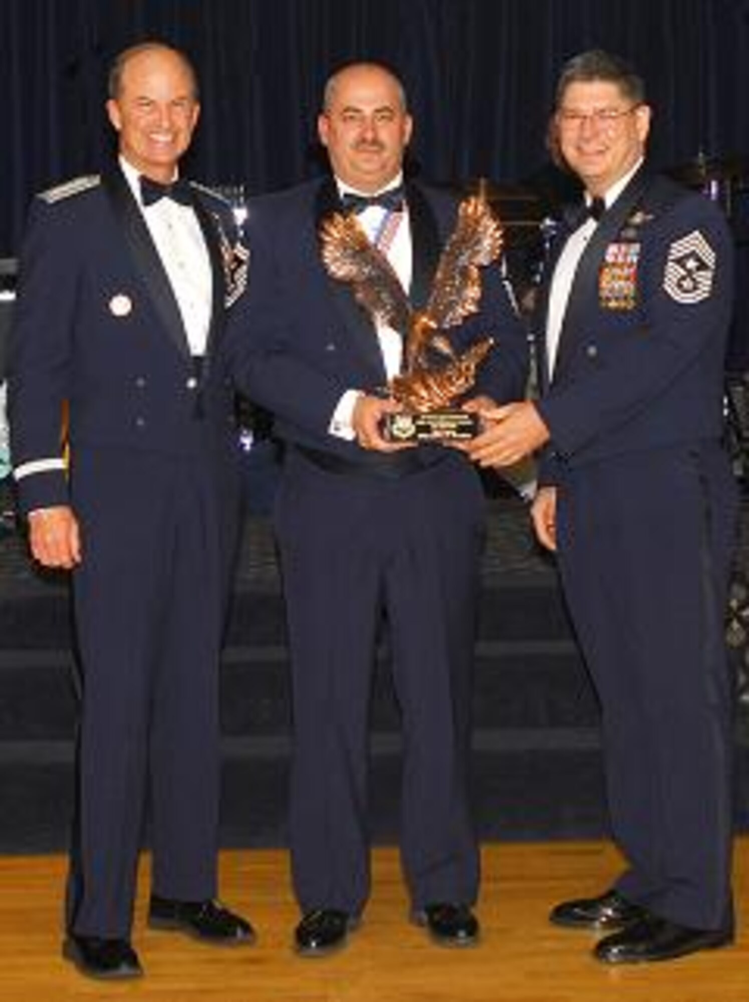 Senior Master Sgt. Jeffrey Neutzling, 341st Missile Security Forces Squadron, was named one of Air Force Space Command's Outstanding Airmen of the Year for the First Sergeant Category April 27. He received the honor from Gen. Kevin P. Chilton, AFSPC commander, and Chief Master Sgt. Michael Sullivan, AFSPC command chief. (U.S. Air Force photo / Tech. Sgt. Raheem Moore)