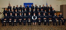 MINOT AIR FORCE BASE, N.D. -- Airmen here take an official photo as part of their Community College of the Air Force graduation ceremony at the Jimmy Doolittle Center May 2. Overall, 91 Airmen earned CCAF degrees. The CCAF is a federal program which grants two-year Associates of Applied Science degrees in association with the Air Force’s Air University. The CCAF recently reached an agreement with about 20 universities and colleges that will accept CCAF credits earned by Airmen and apply them toward a bachelor’s degree related to the Airman’s Air Force specialty. (U.S. Air Force photo by Airman 1st Class Cassandra Butler)