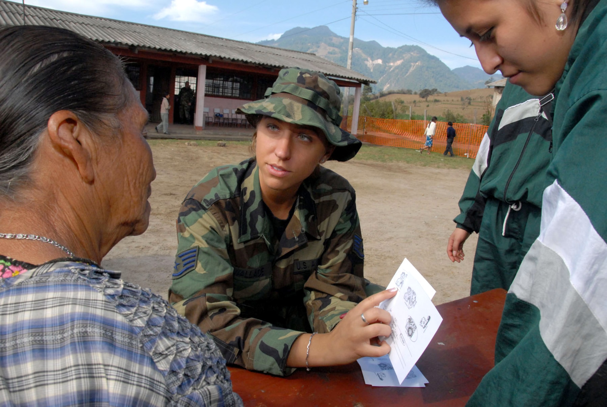 Staff Sgt. Lisa Wallace with the help of a student interpreter triages a patient set to receive medical care during the New Horizons Medical Readiness Training Exercise conducted April 14 through 28 in the region of San Marcos, Guatemala. The medical team treated more than 8,000 patients during their stay in Guatemala. Sergeant Wallace is a medical technician with the 445th Aerospace Medicine Squadron, Wright Patterson Air Force Base, Ohio. (U.S. Air Force photo/Master Sgt. Chance C. Babin)
