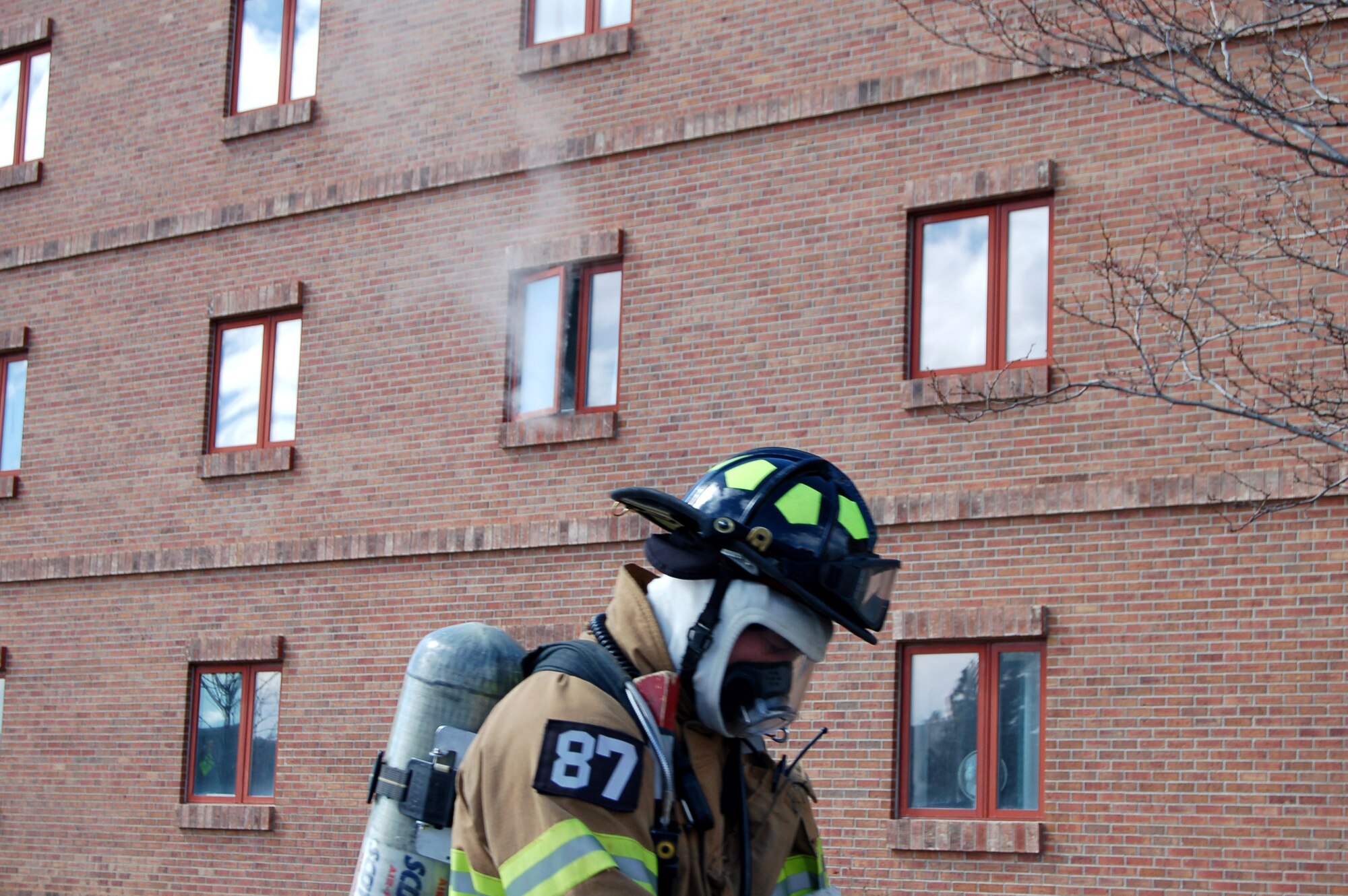 Cary Ulman prepares to enter a dormitory during a firefighting exercise April 10 at Peterson Air Force Base, Colo. The training is essential to keeping the firefighters sharp and ready to perform their duties in a moment's notice. (U.S. Air Force photo/Staff Sgt. Jeremy Larlee) 
