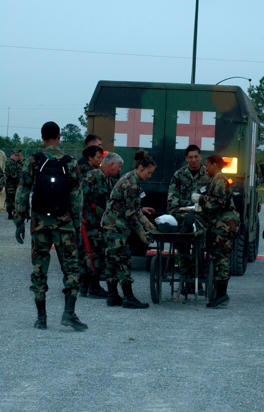 Air Force Reservists belonging to the 908th Airlift Wing's 908th Aeromedical Staging Squadron personnel simulate transporting a contingency aeromedical staging facility patient to an ambulance. A CASF is a 24-hour medical holding and staging facility. (U.S. Air Force photo by Mr. Jeff Melvin)