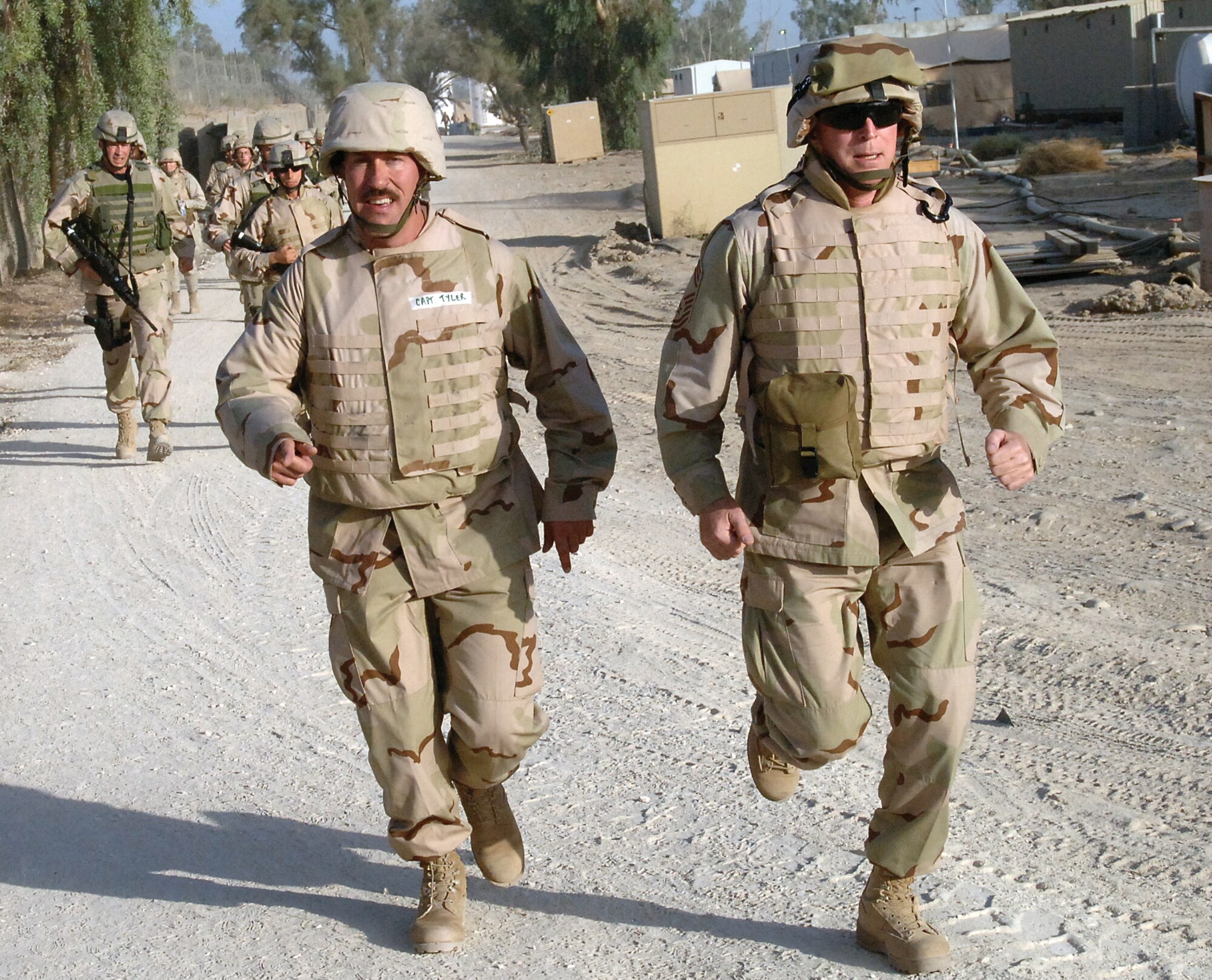 SOUTHWEST ASIA - Air Force Reservist Chief Master Sgt. Gordon Swarthout (right) leads his unit on a training run while deployed to Iraq. Assigned to the Air Force Reserve's 86th Aerial Port at McChord Air Force Base, Wash., the Chief deployed to Iraq for four months, gaining a greater appreciation for the contributions of Reservists to the Air Force mission.