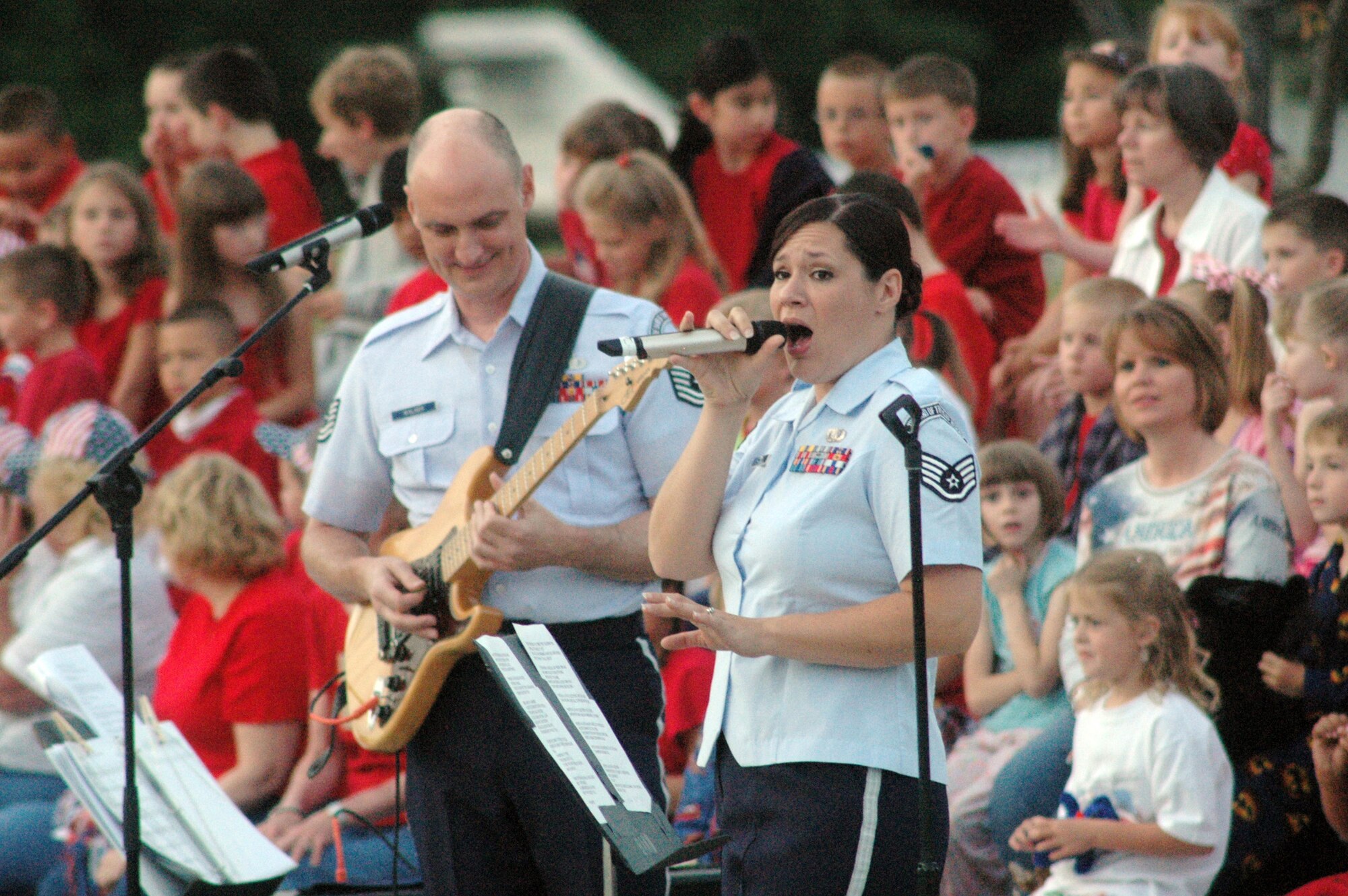TSgt. Rob Walker, guitar, and SSgt. Frances Hudlow, vocalist, and other members of Reserve Generation, a component of the Band of the United States Air Force Reserve provided music for the 12th We Love America program. U. S. Air Force photo by Sue Sapp