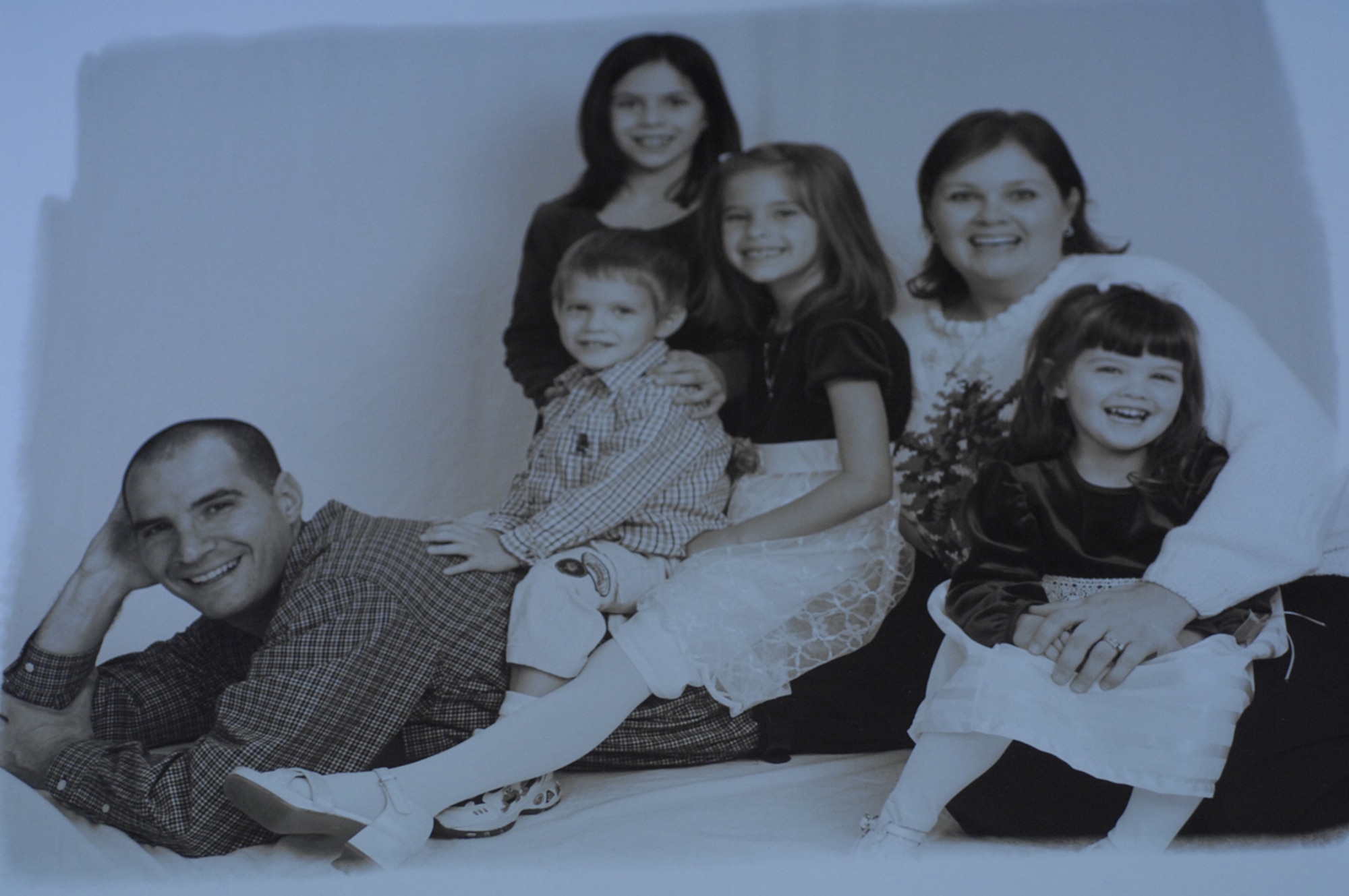The Lombardos, in their last family photo taken with Chloe just before the accidental poisoning, are reminded of happier times with Chloe sitting on mom’s lap and Kevin Jr. and Lidia sitting on their dad’s back, flanked by oldest sister Lexie. (Courtesy of the Lombardos family)