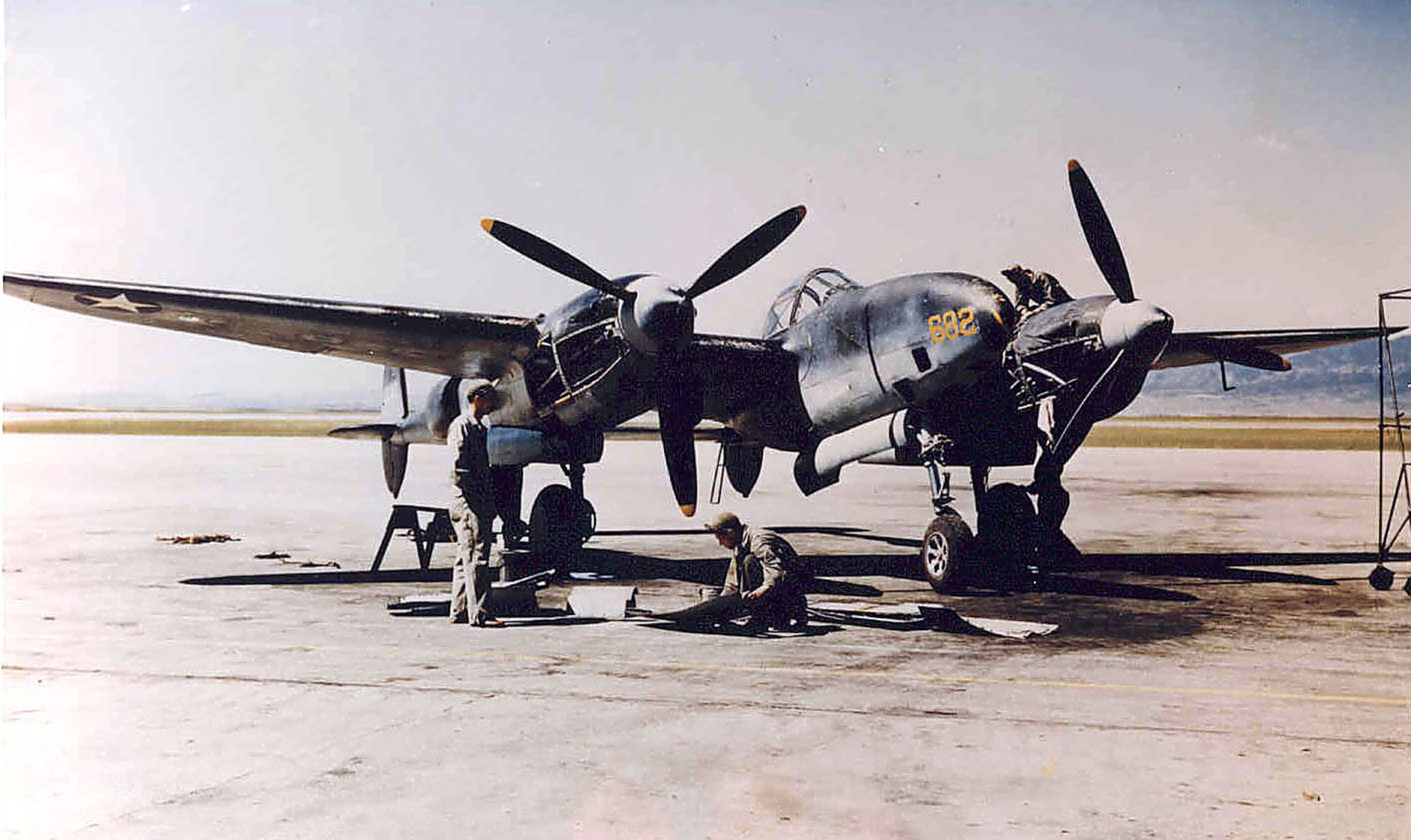 PETERSON AFB, Colo. -- A maintenance crew works on a Lockheed F-5 “Photo Lightning” at Peterson Field in 1943. The F-5 was the photographic reconnaissance version of the P-38 “Lightning” fighter, and equipped many of the reconnaissance squadrons trained here during World War II. (U.S. Air Force photo)
