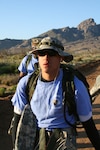 Army Sgt. Heriberto Ruiz-Sierra, 314th Military Intelligence Battalion, leads from the front. He steps out at the head of his group, knowing what challenges lie ahead during the Bataan Memorial Death March on March 25 at White Sands Missile Range, N.M.. During the march he often turned to his comrades and offered words of encouragement or advice. (USAF photo by Army Spc. Tim Luukkonen)