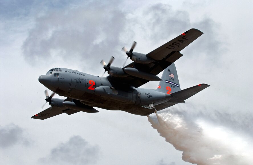 A C-130H Hercules from the 302nd Airlift Wing, Peterson Air Force Base, Colo., drops water May 2, 2007, at the Albuquerque (N.M.) Air Tanker Base during annual Modular Airborne Fire Fighting System training. C-130 aircrews from the Air Force Reserve Command unit and three Air National Guard units trained with  MAFFS delivery system in preparation for the 2007 wild fire season.  (U.S. Air Force photo/Tech. Sgt. Rick Sforza)