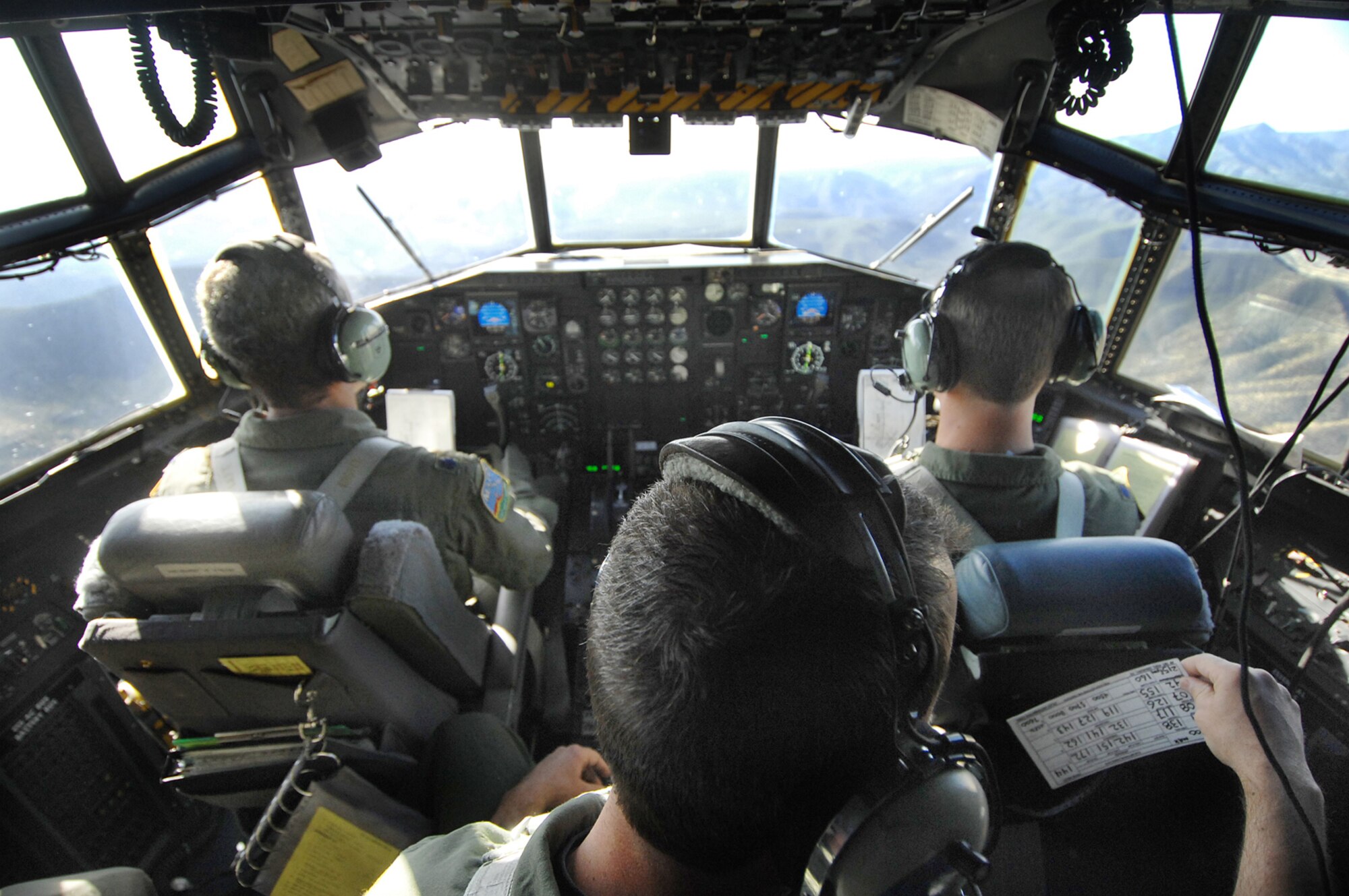 A C-130 from the 731st Airlift Squadron, 302nd Air Wing out of Peterson Air Force Base, Colo., clears a ridge line after taking off May 1, 2007, from Kirtland AFB, N.M., during Modular Airborne Fire Fighting System training at the U.S. Forest Service's Albuquerque Air Tanker Base in New Mexico.  (U.S. Air Force photo/Tech. Sgt. Rick Sforza)