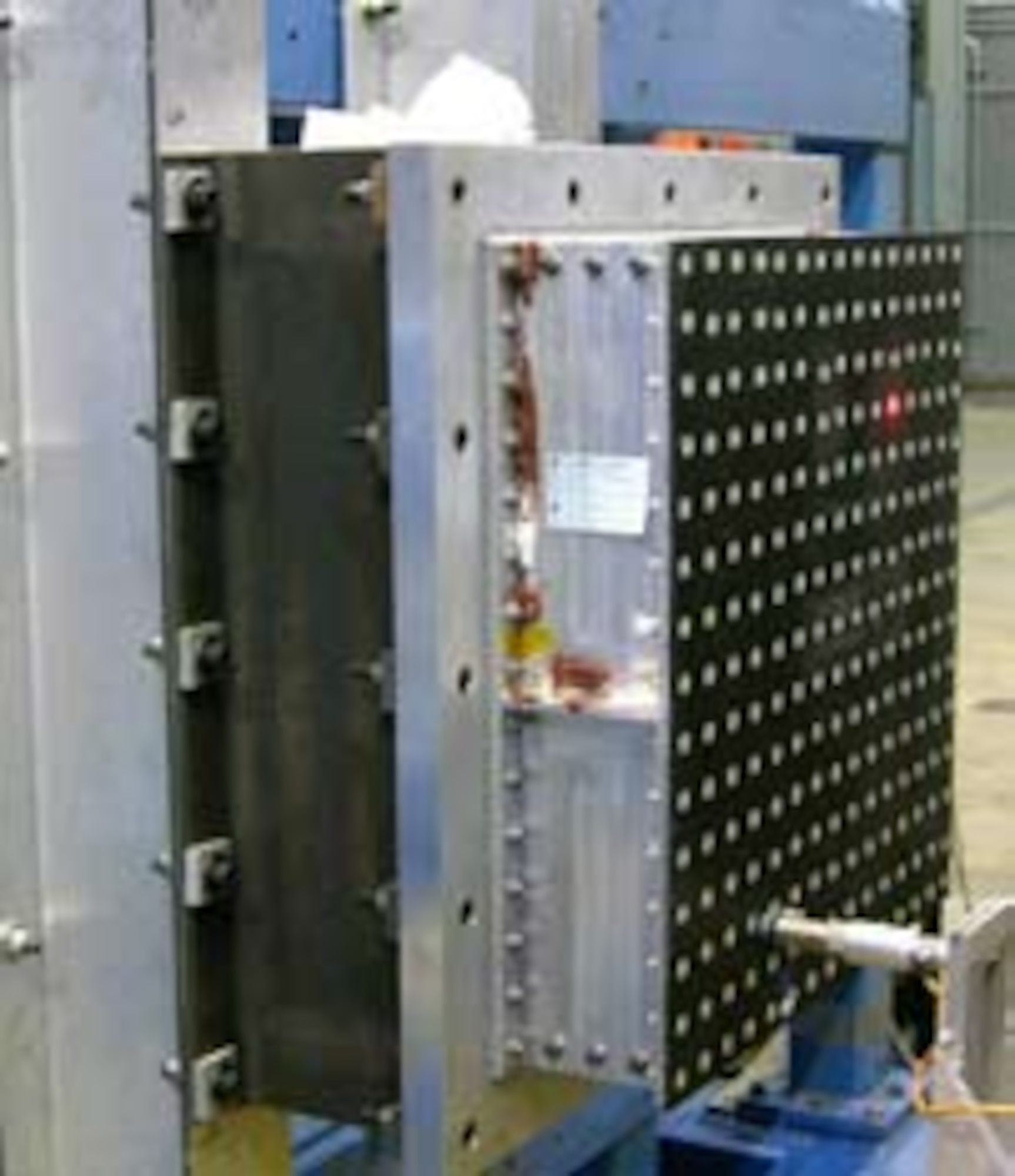 A thin-gage composite skin with a SynCore™ center structure, subjected to acoustic and impact testing, for use on the F-35 Joint Strike Fighter inlet duct