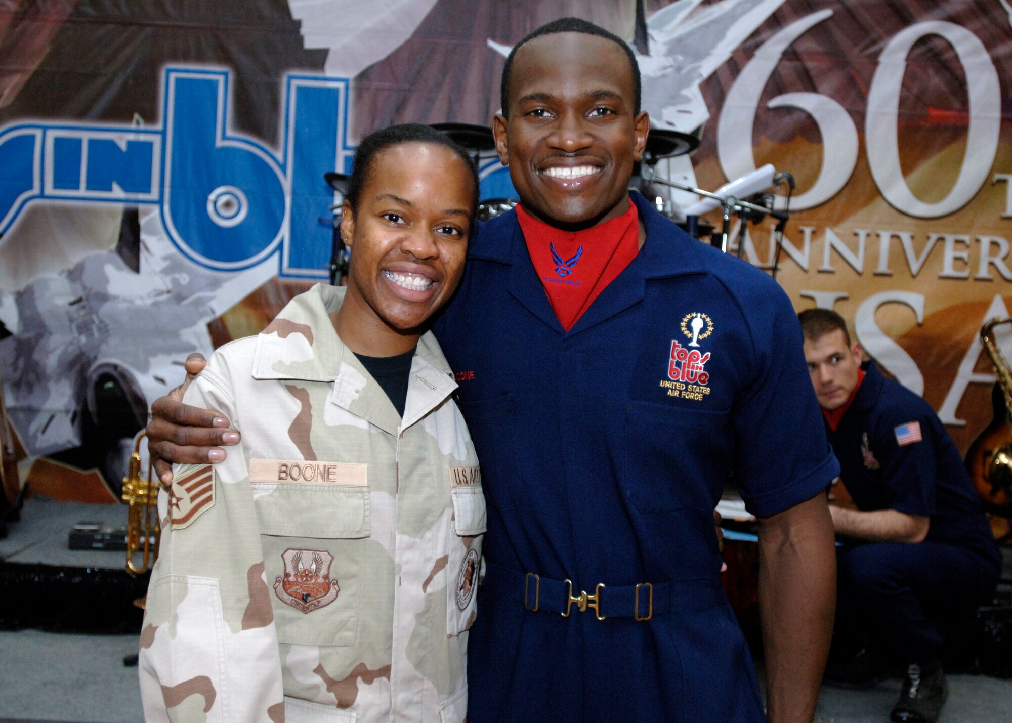 SSgt Kara Boone gets to see her brother SSgt Wendell Boone perform while deployed to Southwest Asia.  The Tops in Blue crew performs for the members of the 386th Air Expeditionary Wing on Wednesday, 2 May 2007, at an undisclosed location in Southwest Asia.  Known as the Air Force's Expeditionary Entertainers; the groups main mission is to perform for military personnel and their families throughout the world. (USAF photo by TSgt Edward D. Holzapfel) RELEASED
