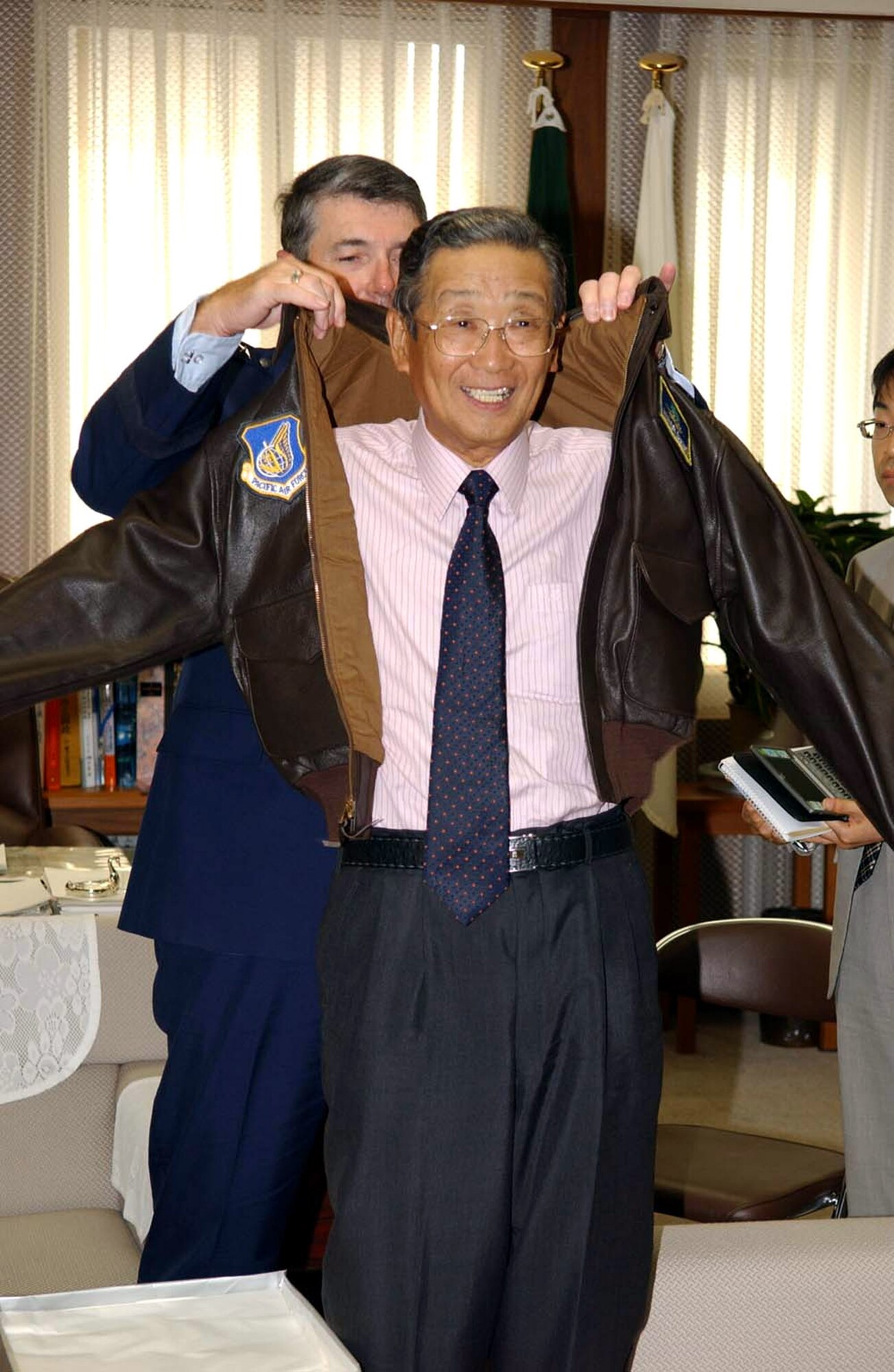 Gen. Paul V. Hester presents Misawa City Major Shigeyoshi Suzuki with his own U.S. Air Force flight jacket in August 2006 at Misawa City, Japan. Mayor Suzuki, a longtime friend and supporter of American servicemembers, their families and the Air Force mission in Northern Japan, passed away May 1 from pneumonia at the age of 66. Mayor Suzuki served as mayor of Misawa City, representing a city of 40,000, for more than two decades and was in his sixth term upon his death. Throughout his years as mayor, he laid the foundation for strong relations between the base and the local area. General Hester is the Pacific Air Forces commander. (U.S. Air Force photo/Senior Airman Robert Barnett)
