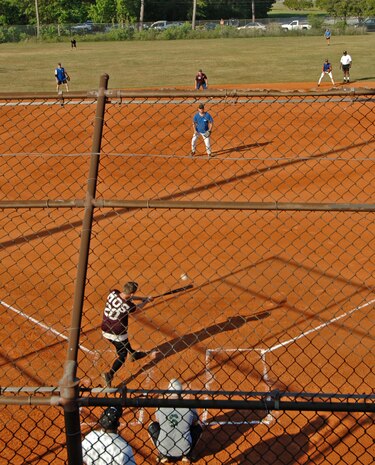 Staff Sgt. Joseph Sparlin 437th Maintenance Operations Squadron slams the ball to Maintenance Squadron 1 outfield allowing MOS to score. (U.S. Air Force photo/Staff Sgt. April Quintanilla)