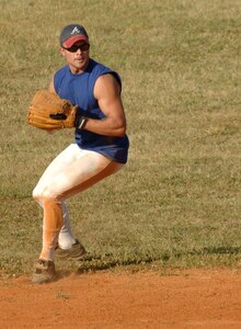 Senior Airman David Hardy Maintenance Squadron 1 looks before throwing the ball to first base.  (U.S. Air Force photo/Staff Sgt. April Quintanilla)