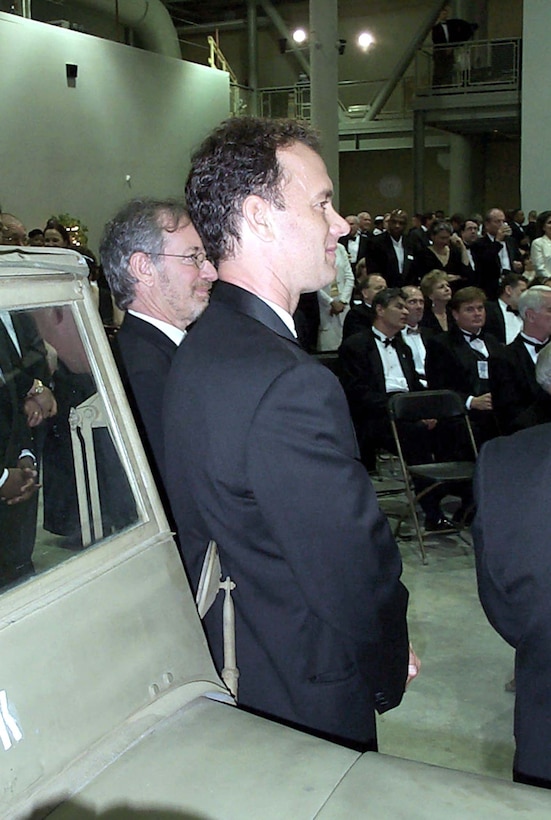 Saving Private Ryan" director Steven Spielberg (left) and star Tom Hanks stand next to a World War II jeep during dedication ceremonies at the National D-Day Museum in New Orleans. During the June 6 ceremony, Defense Secretary William S. Cohen presented museum founder Stephen Ambrose with the Defense Medal for Distinguished Public Service, the highest award the department presents to civilians. Photo by Jim Garamone. 