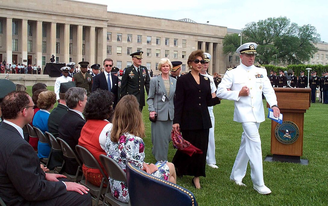 Military officers escort Janet Langhart Cohen, Carolyn Shelton, as ...