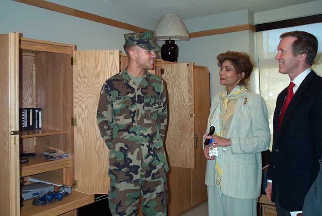 Marine Corps Pfc. Jacob Martin, F Battery, 2nd Battalion, 11th Marine Regiment, shows off his newly renovated barracks room at Camp Pendleton, Calif., to Defense Secretary William Cohen and his wife, Janet Langhart Cohen, Jan. 6. Photo by Staff Sgt. Kathleen T. Rhem, USA. 
