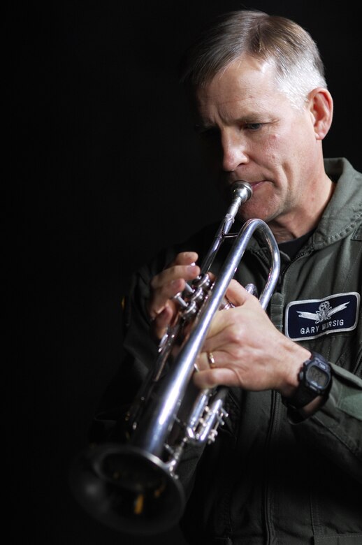Col. Gary Wirsig, 30th SW chief of safety, plays trumpet as a creative outlet as well as in church and at the Retreat & Reville ceremony at the 30th Space Wing headquarters building April 18. (Photo by Staff Sgt. Denoris Mickle)