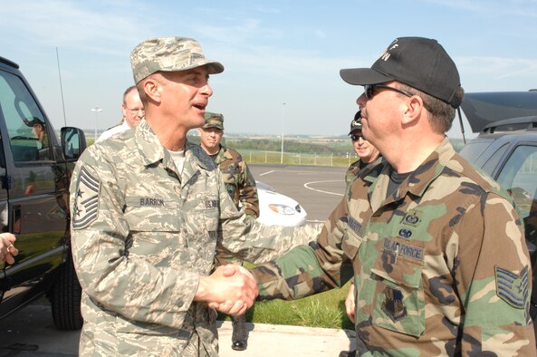 SPANGDAHLEM  AIR BASE, GERMANY-- Air Mobility Command Chief Master Sgt. Joseph Barron talks with Tech. Sgt. Michael Wolcott, 52nd Fighter Wing safety office, before taking a ride with him on Spangdahlem’s new Saber Driving Course April 26. Chief Barron visited Spangdahlem for two days during a recent U.S. Air Forces in Europe trip. Initially, the Saber Driving Course training will be available to First Term Airman Center students age 26 years and younger. For more information on the Saber Driving Course, call the safety office at 452-7233. (US Air Force photo/Airman 1st Class Stephanie Clark)