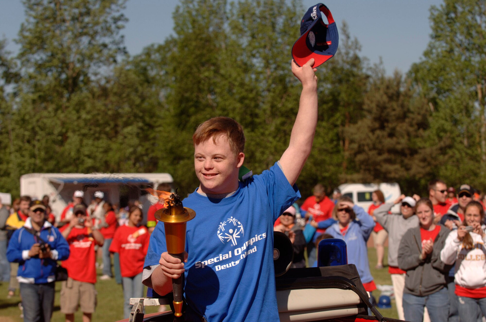 Bryan Hogg of Kaiserslautern High School carries the ceremonial torch during the opening ceremonies of the 2007 Special Olympic Games May 2 in Enkenbach-Alsenborn, Germany. Numerous German and American volunteers from the Kaiserslautern military community assisted more than 750 Special Olympians who competed in the 24th annual games here. (U.S. Air Force photo/Master Sgt. Scott Wagers)
