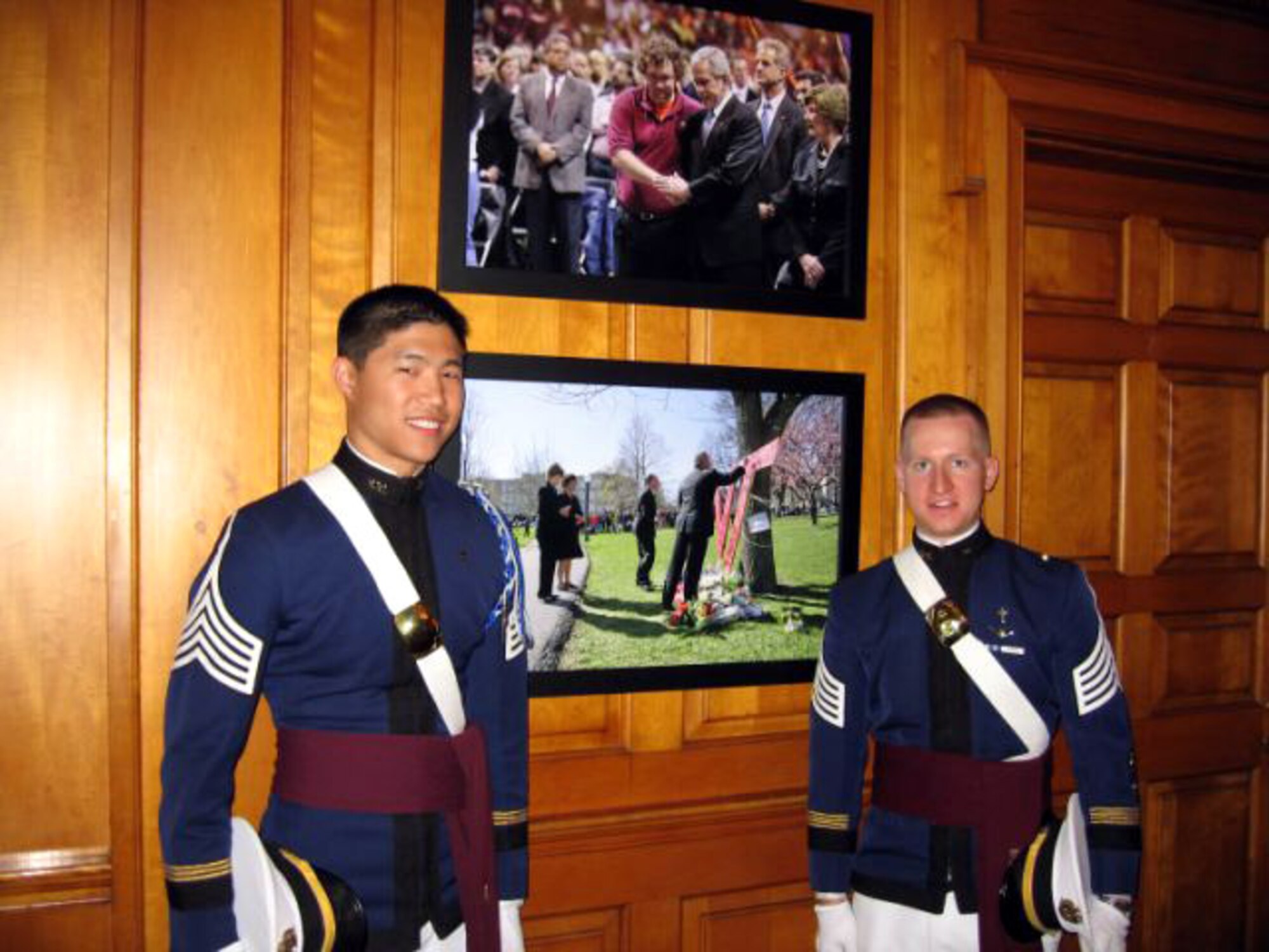 Virginia Tech Cadets Houston Yu and James Compton the stand with two photos taken during the president's April 17 visit to Virginia Tech May 3 at the White House in Washington, D.C. The photos are prominently displayed at the East Wing entrance. Cadet Yu, the regimental chaplain, and Cadet Compton, the chaplain for the highty-tighties, were invited guests of the National Day of Prayer. The cadets are members of the Virginia Tech Air Force ROTC.(Courtesy photo)
