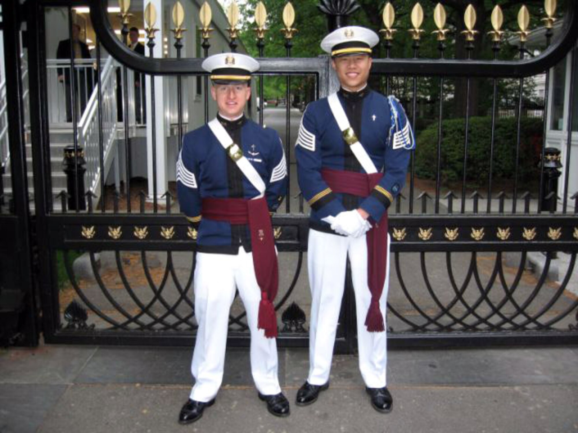 Virginia Tech Cadets James Compton (left) and Houston Yu stand at the visitor's gate of the White House May 3 in Washington, D.C. Cadet Yu, the regimental chaplain, and Cadet Compton, the chaplain for the highty-tighties, were invited guests of the National Day of Prayer. Cadet Yu was one of five speakers at the ceremony. He met President George W. Bush before the ceremony, and read the National Prayer just before the president spoke. The two are Air Force ROTC cadets. (Courtesy photo) 