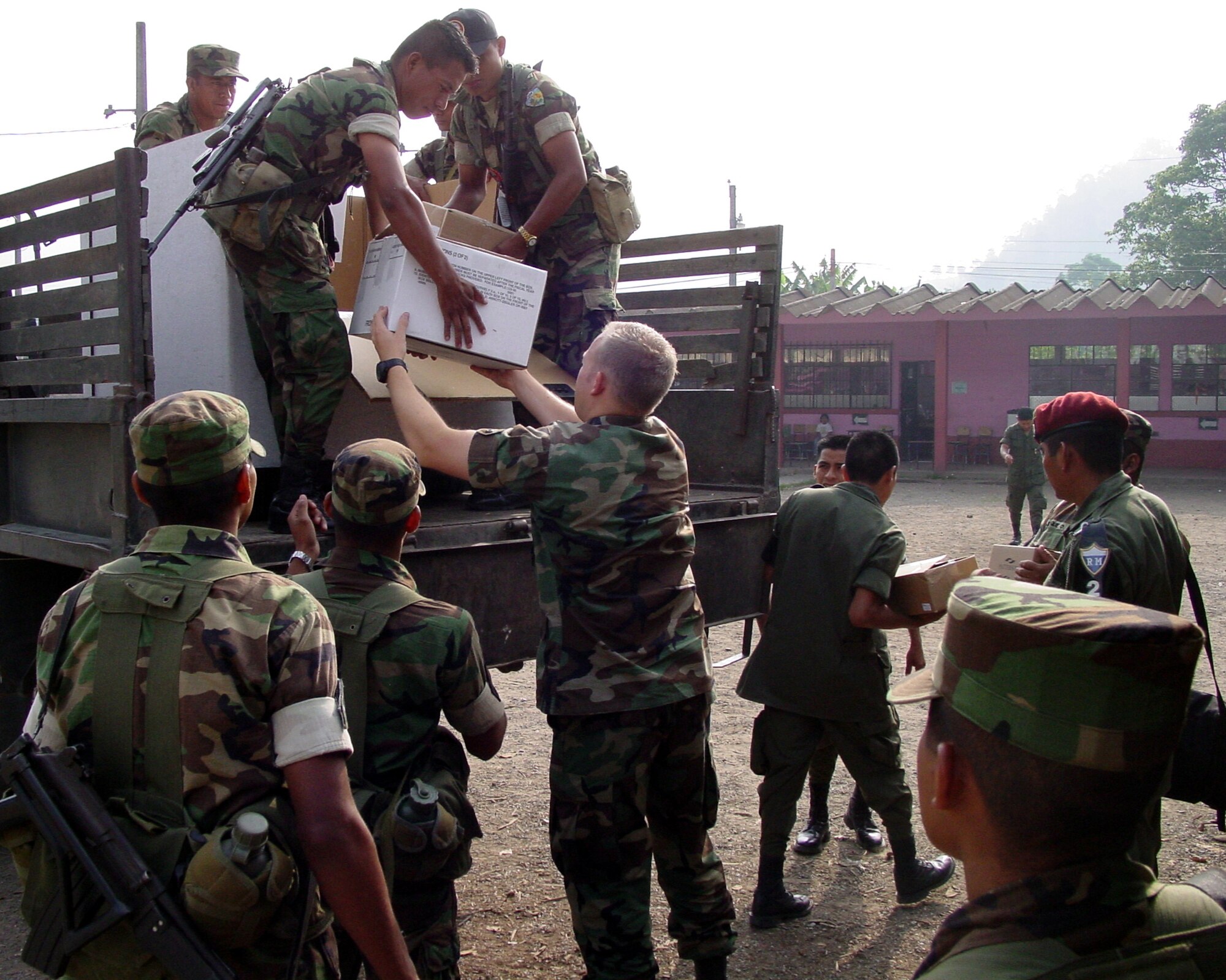 Capt. (Dr.) Daniel Rohweder, a physician from Vandenberg AFB, Calif., helps Guatemalan soldiers unload medical supplies during a humanitarian mission to some of the poorest regions of Guatemala.  A team of 13 medical professionals from Air Force Space Command deployed to the area and treated more than 8,000 patients during the last 10 days of April. (U.S. Air Force Courtesy Photo)