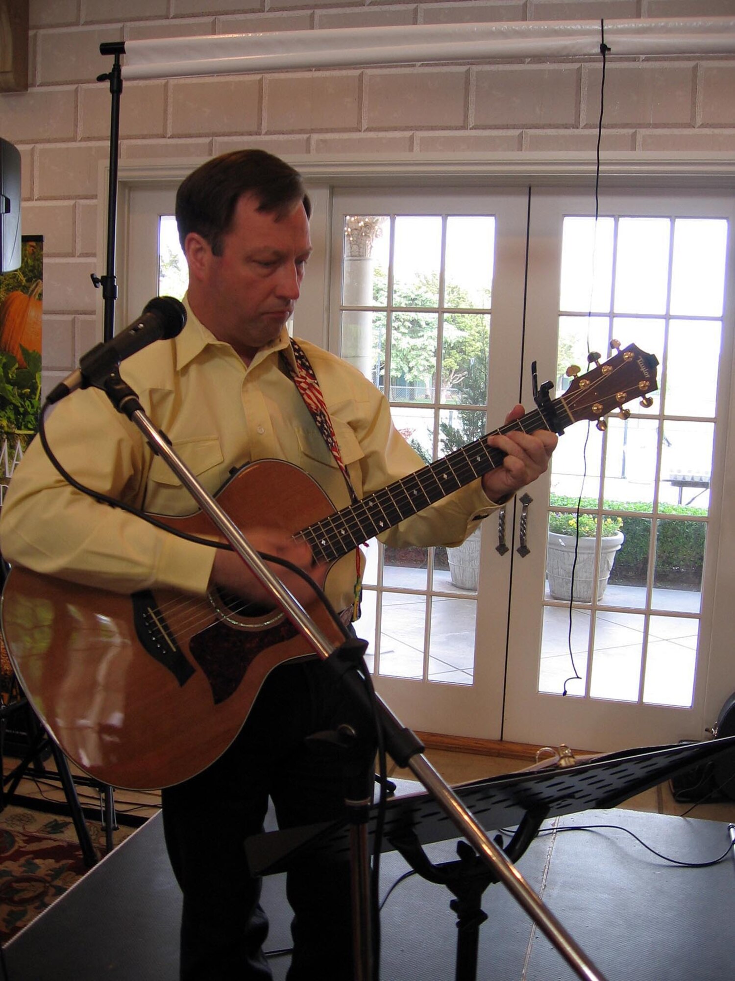 Senior Master Sgt. Ken Girty, first sergeant for the 18th Air Refueling Squadron plays a number at the Agriculture and Tourism Convention in Oklahoma City April 18.   The convention where he appeared as guest artist was slated by state legislators to bring the two areas of the state’s commerce together in a program targeted at increasing areas of tourism. (Photo courtesy of Laura Girty)