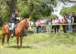 DeWayne Henderson, manager of the Lackland Saddle Club at Lackland Air Force Base, Texas, is mounted on his horse, Risky, explaining the Civil War uniform and Soldier's life during the war, to the Defense Language Institute English Language Center staff and faculty, AMIGO Sponsors and international students present. The break from the classroom allowed the students to use their new English skills to communicate with picnic attendees. The DLIELC is responsible for teaching English to international military and civilians from more than 90 allied countries.  The second mission, through the Field Studies Program Division, is to present the American culture in all its aspects. (USAF photo by Robbin Cresswell)