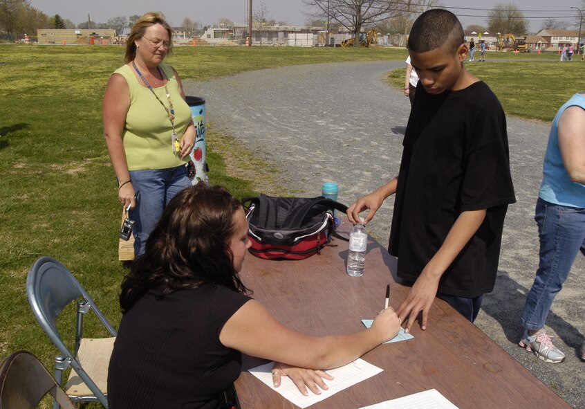 DOVER AIR FORCE BASE, Del. -- Austin Kernodle, Dover Air Force Base Middle School student, has a peice of paper that desginates the number of laps he did during a Diabetes fundraising walk here April 24. Austin, whose grandmother has diabetes, raised $785 in support of diabetes research. (U.S. Air Force photo/Senior Airman James Bolinger)