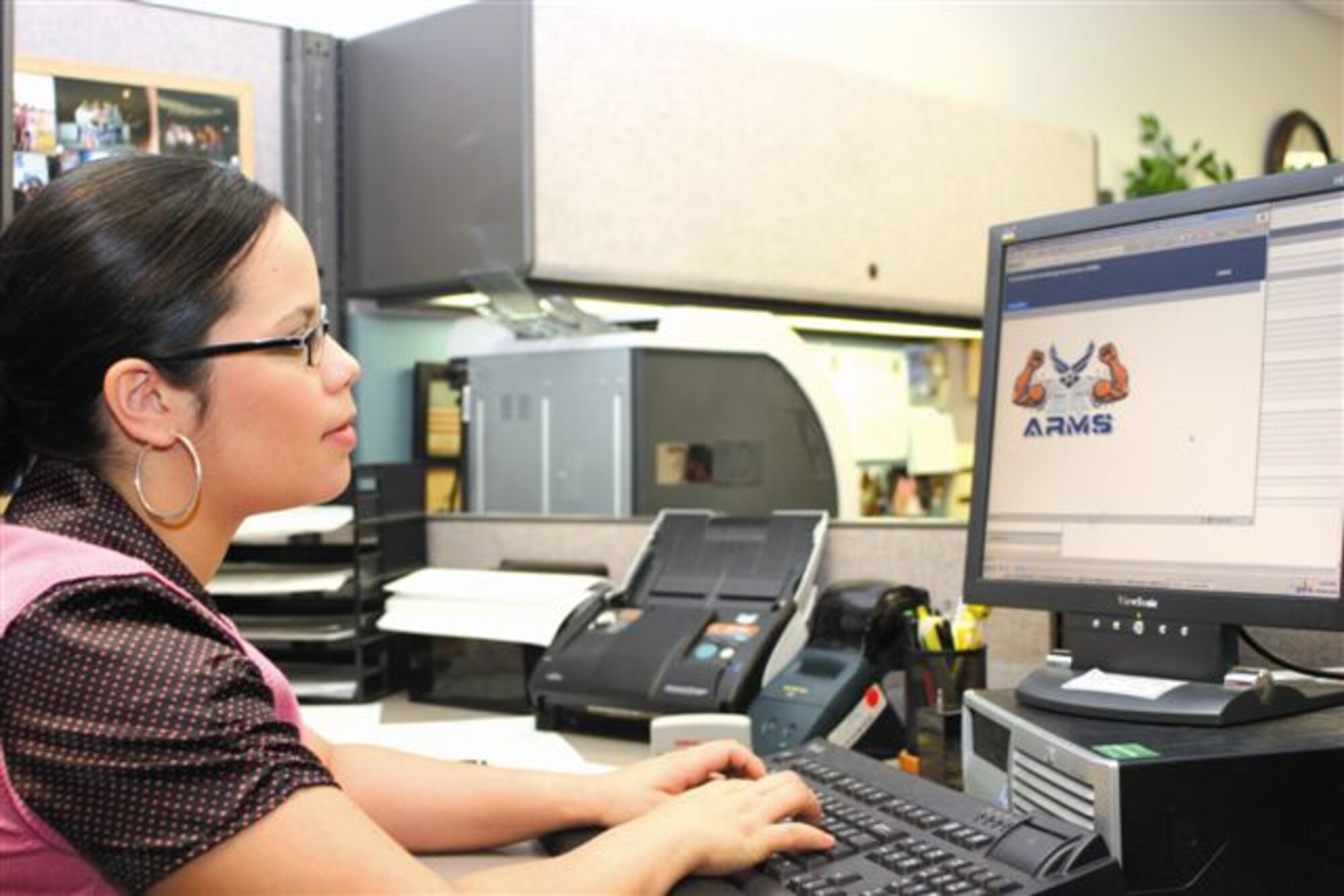 Charlynne Garcia, 509th Mission Support Squadron military personnel flight,
demonstrates how to retrieve electonic records online Wednesday. (U.S. Air Force photo/Staff Sgt. Rob Hazelett)