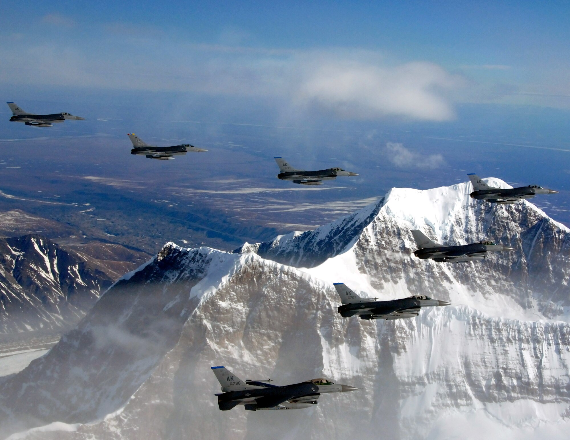 F-16 Fighting Falcons fly in formation April 25 over the Pacific Alaska Range Complex. The F-16s are from the 18th Fighter Squadron at Eielson Air Force Base, Alaska. (U.S. Air Force photo/Master Sgt. Robert Wieland)